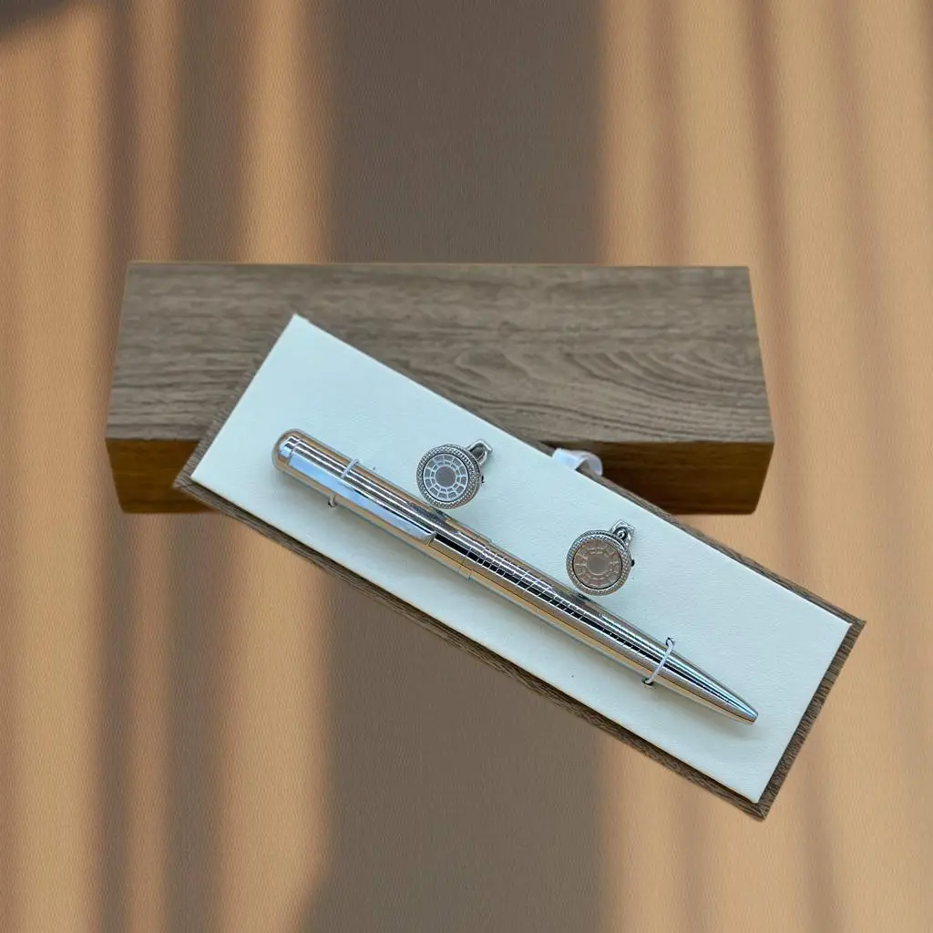 A Set Of Cupcakes and A Silver Pen