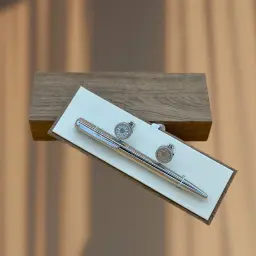 A Set Of Cupcakes and A Silver Pen