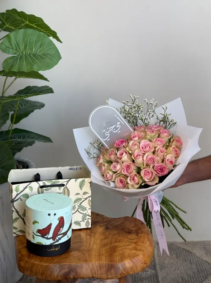 Bouquet of roses with chocolate and a planter