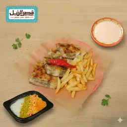Hawawshi + French fries + tahini + rice pudding