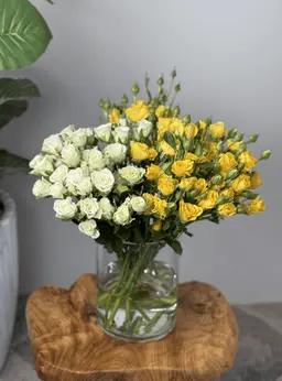 Yellow and white baby rose vase