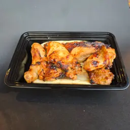 Half A Chicken Grilled On Charcoal