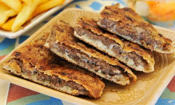 Chefs Hawawshi with Meat, Cheese, and Olive Slices