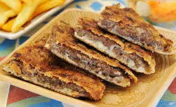 Chefs Hawawshi with Meat, Cheese, and Olive Slices