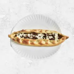 Meat with Dough, Pomegranate Molasses, and Arugula