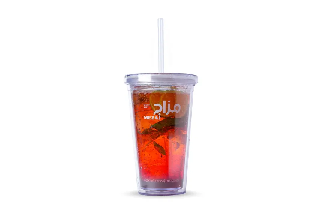Red drink in transparent cup