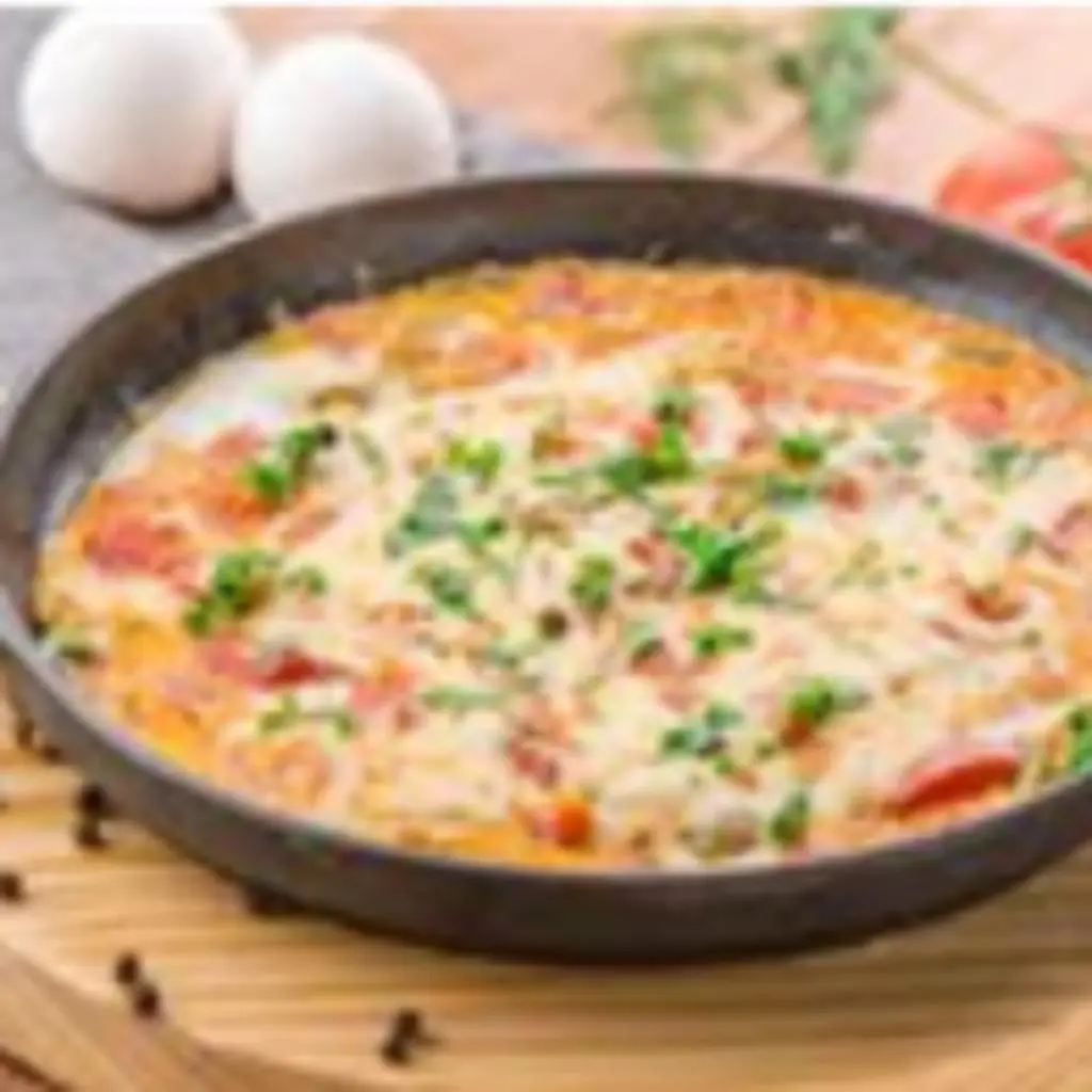 Tomato Qalaya with Eggs & Cheese