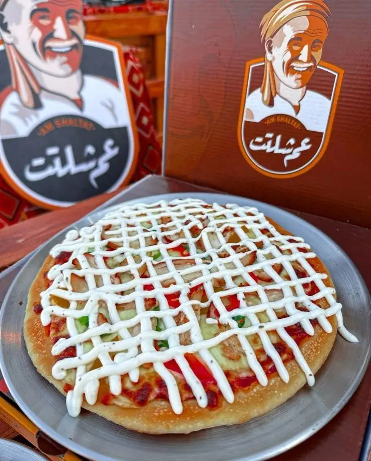 Large crunchy chicken pizza with sauce