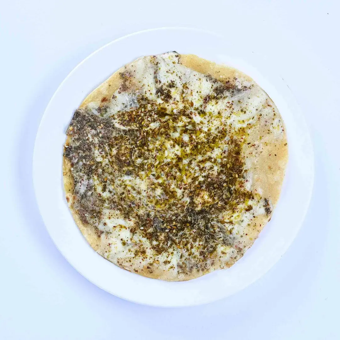 Mix Zaatar with Labneh and Cheese Mana'eesh (Saj)