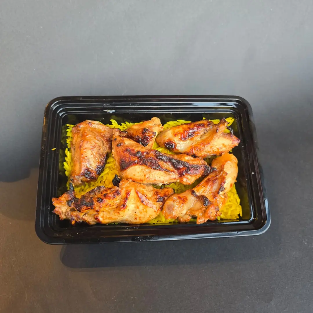 Half A Chicken Grilled On Charcoal