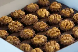 Mini Tart Stuffed With Dates Covered With Walnuts