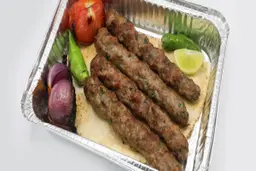 Kebab with pine nuts