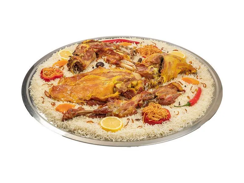 A half of a mandi goat with peshawar rice with plate